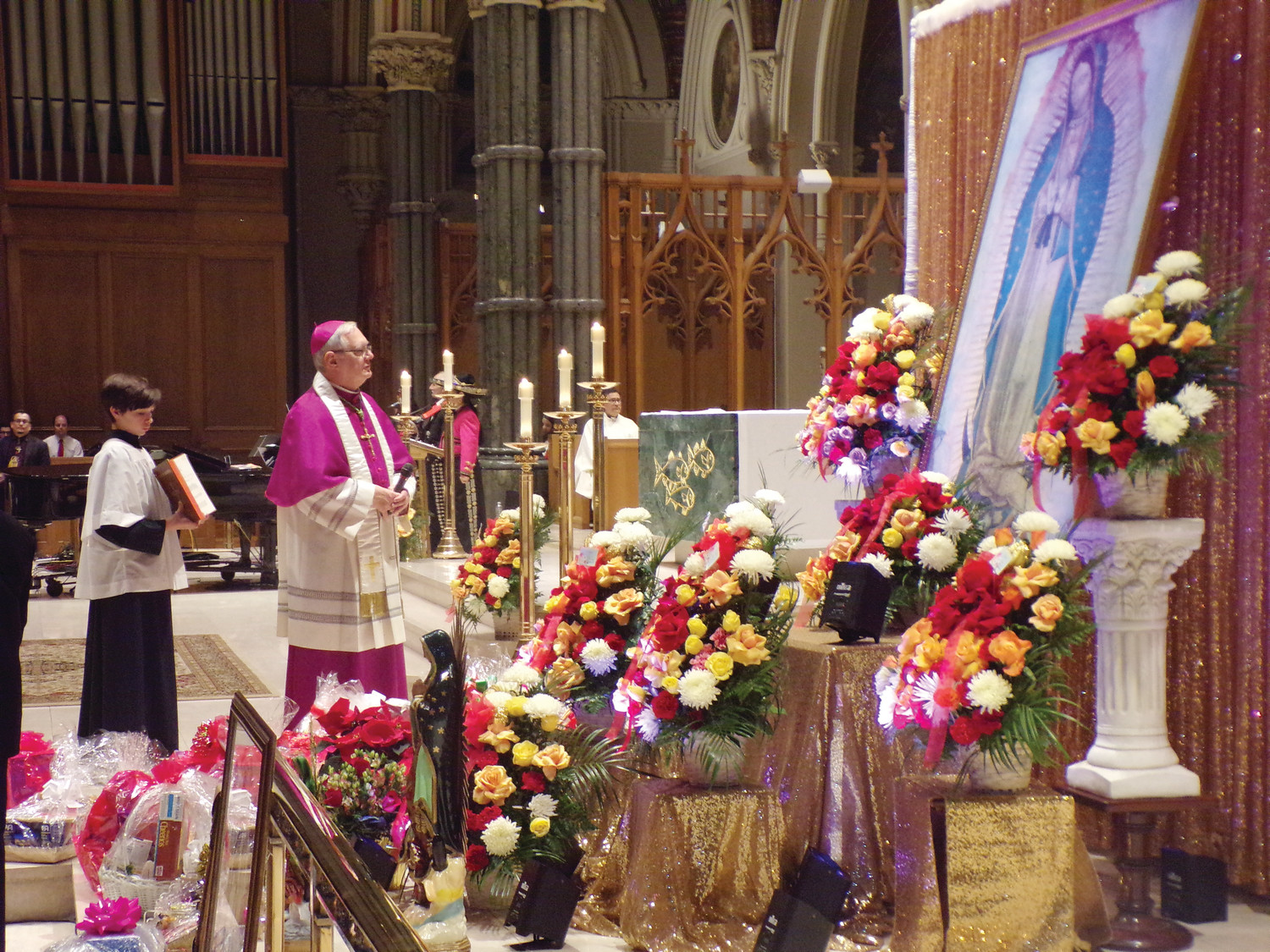 Bishop Thomas J. Tobin prepares to bless the image of Our Lady of Guadalupe during the December 12 Mass at the Cathedral of Saints Peter and Paul, Providence.
